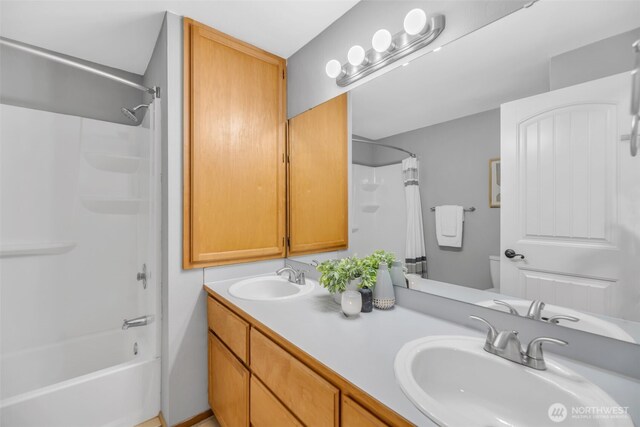 10704 25th Pl NE, Lake Stevens, WA 98258 - bathroom featuring double vanity and shower / bath combo