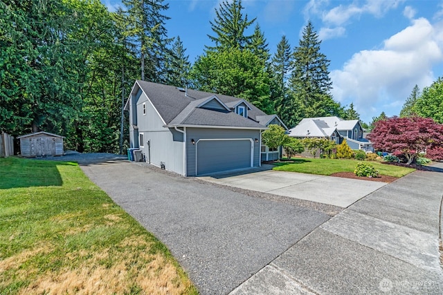 10704 25th Pl NE, Lake Stevens, WA 98258 - view of front of property featuring concrete driveway, a front yard, a garage, and roof with shingles