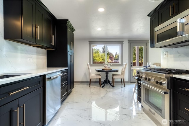 1328 Dakota St, Walla Walla, WA 99362 - kitchen with stainless steel appliances, light countertops, recessed lighting, tasteful backsplash, and baseboards