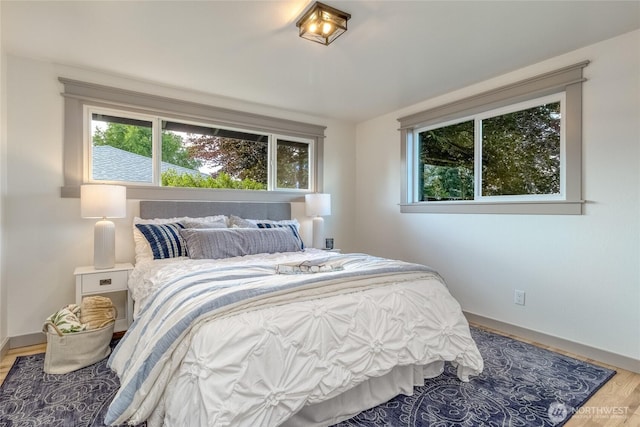 1328 Dakota St, Walla Walla, WA 99362 - bedroom with multiple windows, baseboards, and wood finished floors