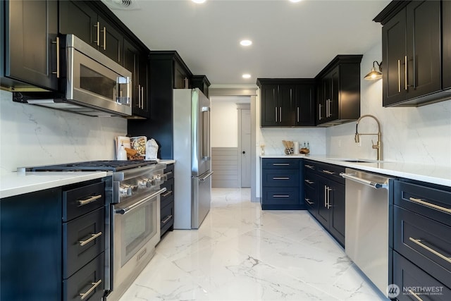 1328 Dakota St, Walla Walla, WA 99362 - kitchen with stainless steel appliances, a sink, decorative backsplash, light countertops, and recessed lighting