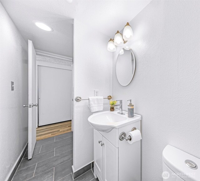 1338 Orleans St, Bellingham, WA 98229 - bathroom with vanity, toilet, and baseboards