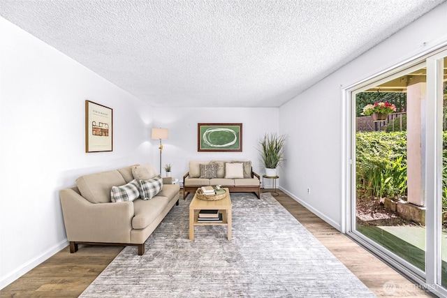 1338 Orleans St, Bellingham, WA 98229 - living area with a textured ceiling, wood finished floors, and baseboards