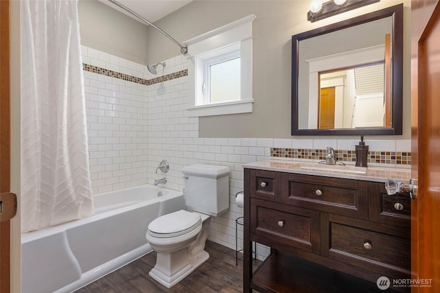11744 NE Sand Point Way, Seattle, WA 98125 - full bath with shower / bath combo, toilet, tile walls, vanity, and wood finished floors