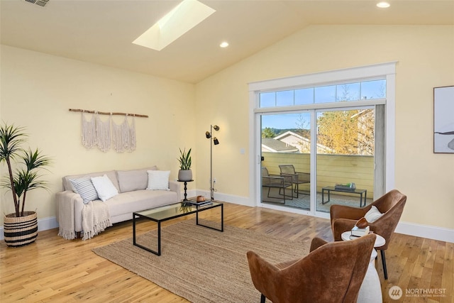 11744 NE Sand Point Way, Seattle, WA 98125 - living room with a skylight, vaulted ceiling, wood finished floors, baseboards, and recessed lighting