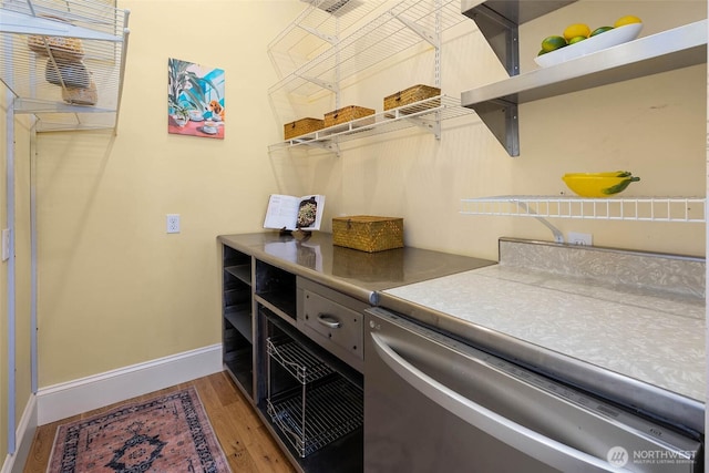 11744 NE Sand Point Way, Seattle, WA 98125 - laundry room with light wood finished floors, baseboards, and washer and clothes dryer