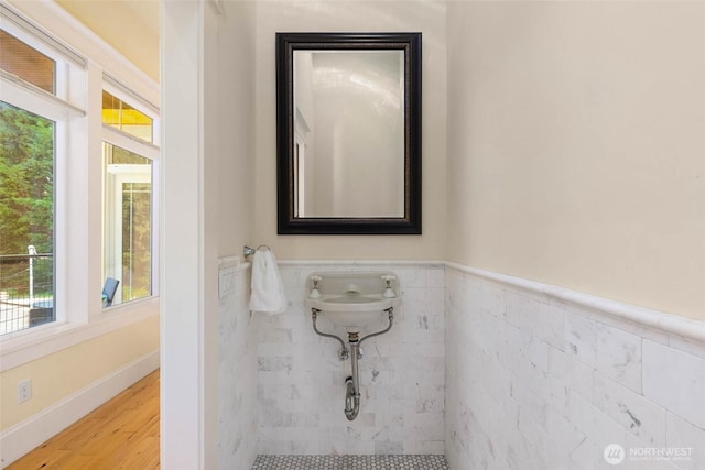 11744 NE Sand Point Way, Seattle, WA 98125 - bathroom with wood finished floors, wainscoting, and tile walls