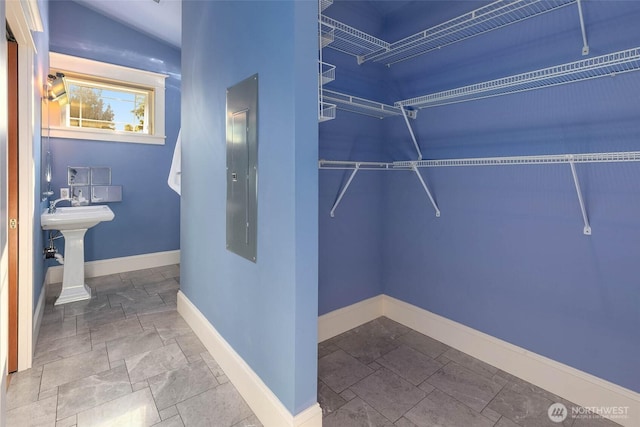 11744 NE Sand Point Way, Seattle, WA 98125 - spacious closet with electric panel and stone tile flooring
