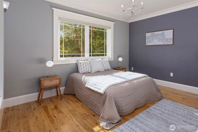 11744 NE Sand Point Way, Seattle, WA 98125 - bedroom featuring a chandelier, wood-type flooring, baseboards, and crown molding