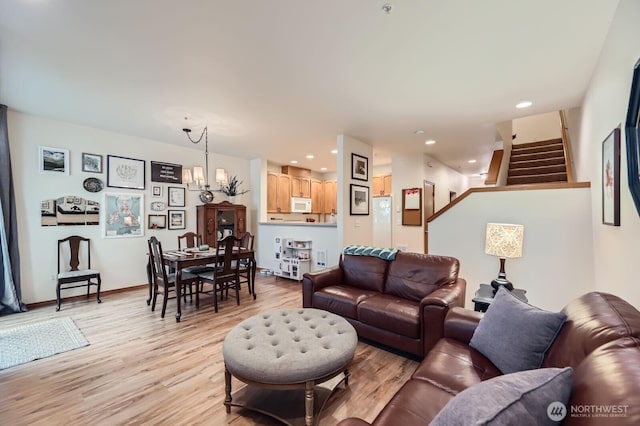 10829 19th Ave SE Unit 3C, Everett, WA 98208 - living room featuring a chandelier, light wood finished floors, stairway, and recessed lighting