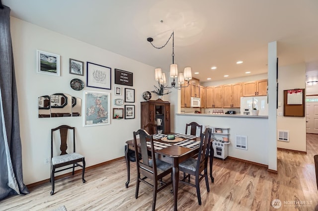 10829 19th Ave SE Unit 3C, Everett, WA 98208 - dining area with a chandelier, light wood-style floors, baseboards, and recessed lighting