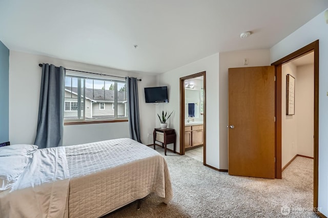 10829 19th Ave SE Unit 3C, Everett, WA 98208 - bedroom featuring light colored carpet, baseboards, and ensuite bathroom