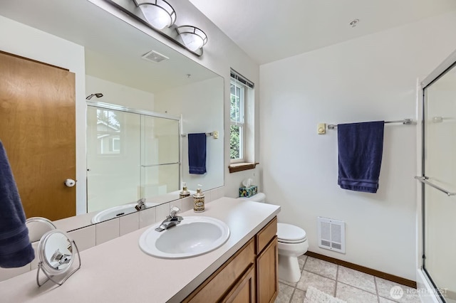 10829 19th Ave SE Unit 3C, Everett, WA 98208 - bathroom featuring a shower with door, toilet, vanity, and baseboards