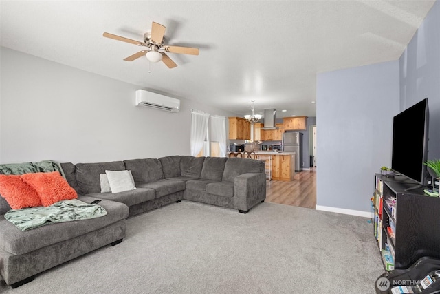 505 Herren Ave, Winlock, WA 98596 - living room featuring a wall mounted air conditioner, light carpet, a chandelier, ceiling fan, and baseboards