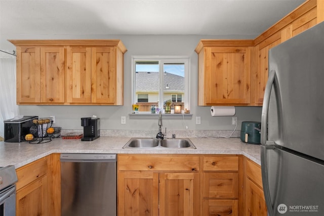 505 Herren Ave, Winlock, WA 98596 - kitchen featuring appliances with stainless steel finishes, a sink, and light countertops
