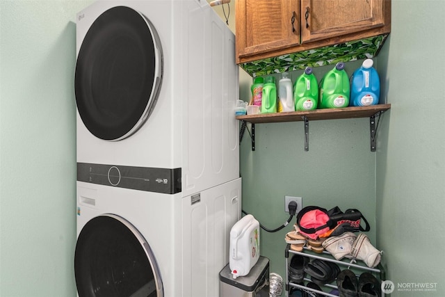 505 Herren Ave, Winlock, WA 98596 - washroom with stacked washer / dryer and cabinet space