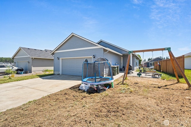 505 Herren Ave, Winlock, WA 98596 - view of side of property featuring an attached garage and driveway
