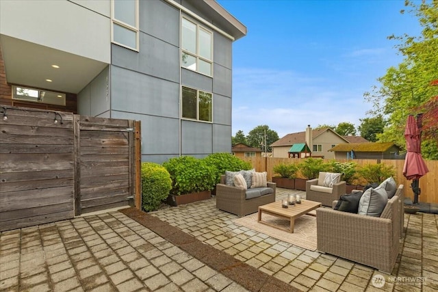 4531 S Kenny St, Seattle, WA 98118 - fenced backyard featuring an outdoor hangout area and a patio