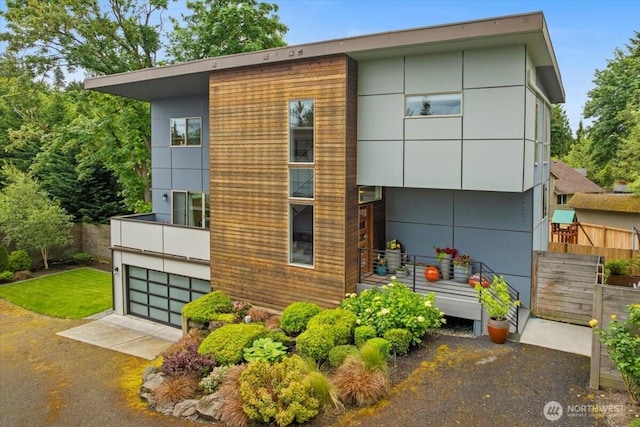 4531 S Kenny St, Seattle, WA 98118 - contemporary house with an attached garage and driveway