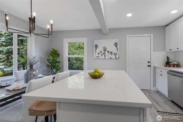 4224 Division Ave W, Bremerton, WA 98312 - kitchen with stainless steel dishwasher, tasteful backsplash, a chandelier, beamed ceiling, and a kitchen island