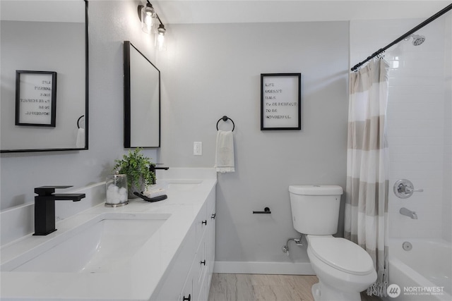 4224 Division Ave W, Bremerton, WA 98312 - bathroom featuring toilet, double vanity, shower / bathtub combination with curtain, baseboards, and marble finish flooring