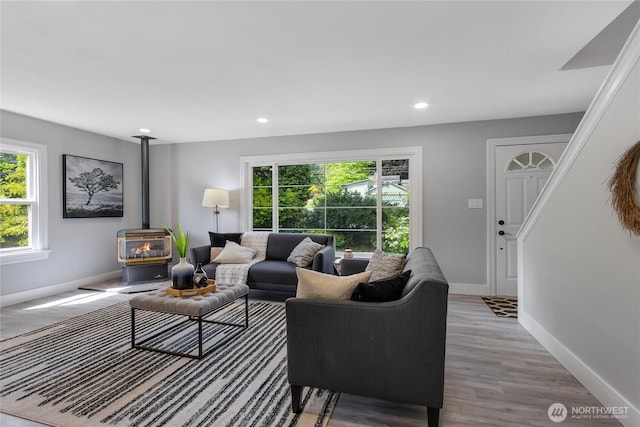 4224 Division Ave W, Bremerton, WA 98312 - living area with a wood stove, baseboards, recessed lighting, and wood finished floors