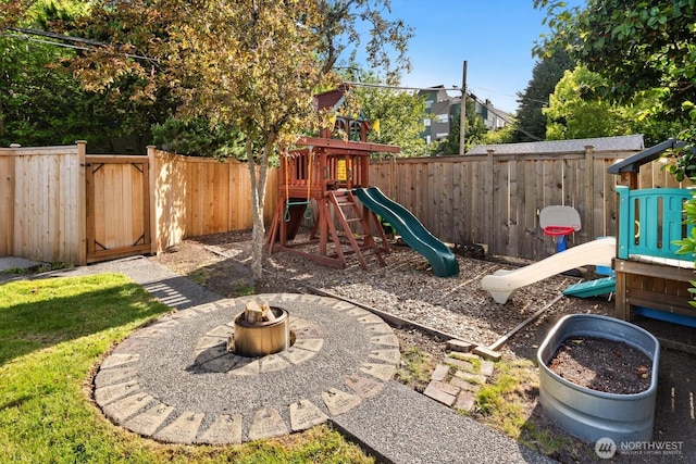 3201 SW Genesee St, Seattle, WA 98126 - view of playground with a fenced backyard and an outdoor fire pit