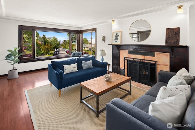 3201 SW Genesee St, Seattle, WA 98126 - living area featuring ornamental molding, a fireplace, and wood finished floors