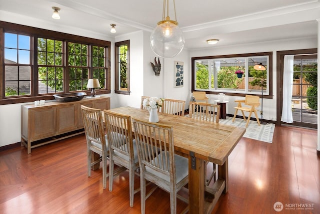 3201 SW Genesee St, Seattle, WA 98126 - dining space with ornamental molding, healthy amount of natural light, and dark wood finished floors