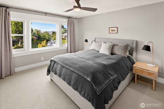 3201 SW Genesee St, Seattle, WA 98126 - bedroom featuring baseboards, light colored carpet, and ceiling fan