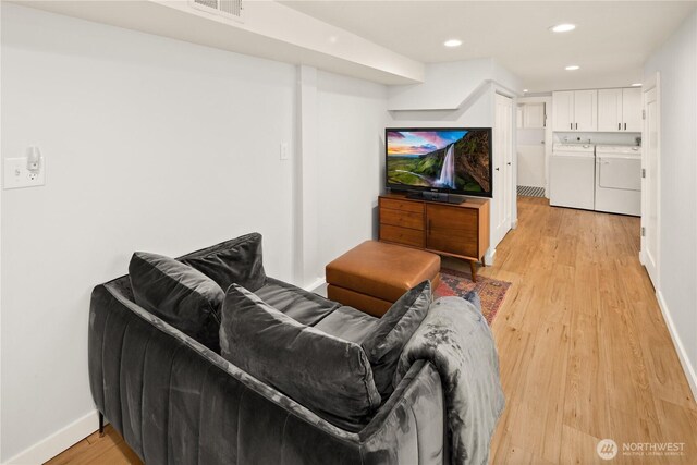 3201 SW Genesee St, Seattle, WA 98126 - living area featuring washing machine and dryer, light wood-style flooring, baseboards, and recessed lighting