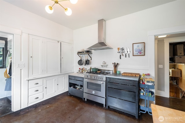 410 N 48th St, Seattle, WA 98103 - kitchen with wall chimney range hood, high end stainless steel range, finished concrete flooring, and white cabinets