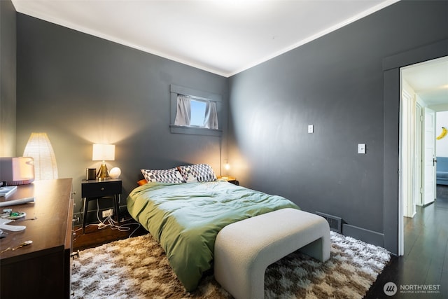 410 N 48th St, Seattle, WA 98103 - bedroom featuring wood finished floors, crown molding, and baseboards