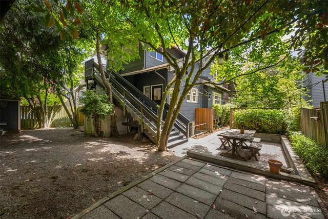 410 N 48th St, Seattle, WA 98103 - fenced backyard with a patio and stairs