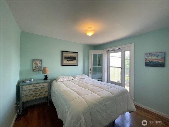 30 Hemlock St N, Soap Lake, WA 98851 - bedroom featuring baseboards, access to outside, and wood finished floors