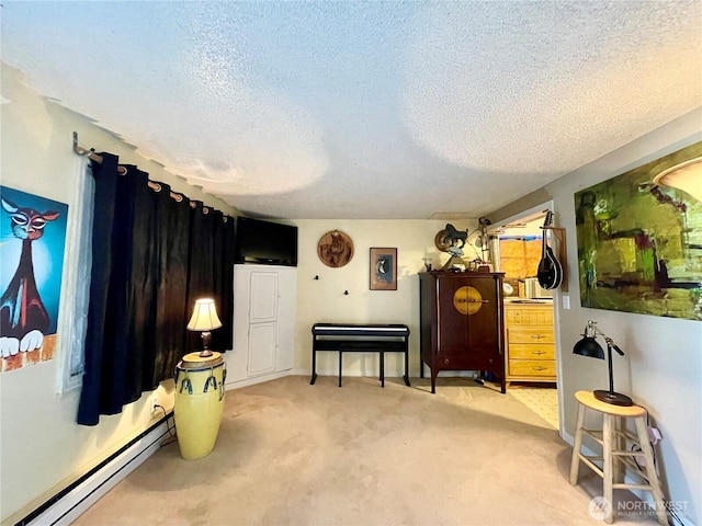 30 Hemlock St N, Soap Lake, WA 98851 - sitting room featuring a baseboard heating unit, a textured ceiling, and light carpet