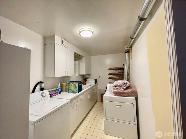 30 Hemlock St N, Soap Lake, WA 98851 - laundry area with cabinet space, light flooring, and independent washer and dryer