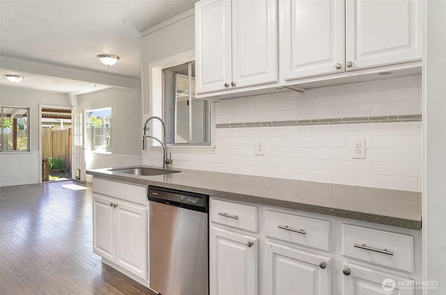 4035 A St, Tacoma, WA 98418 - kitchen with stainless steel dishwasher, a sink, white cabinetry, and tasteful backsplash