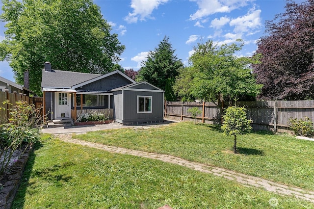 4035 A St, Tacoma, WA 98418 - rear view of property featuring an outdoor structure, a chimney, and crawl space