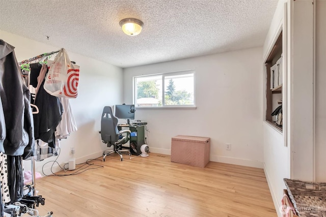 21027 7th Pl S, Des Moines, WA 98198 - home office featuring a textured ceiling and wood finished floors