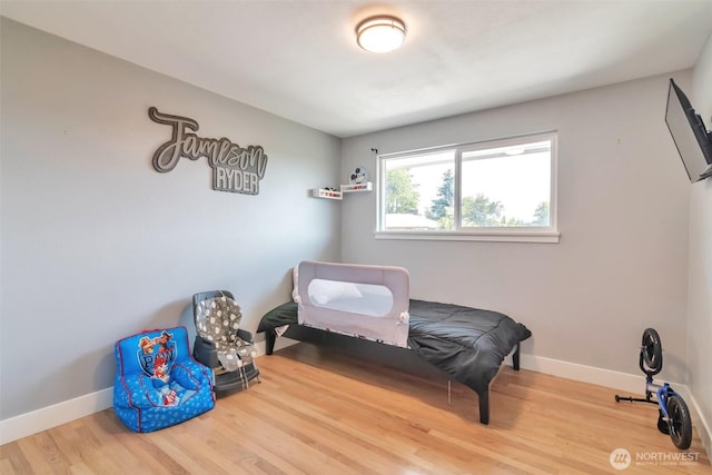 21027 7th Pl S, Des Moines, WA 98198 - bedroom featuring wood finished floors and baseboards