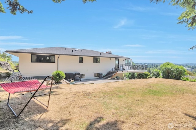 21027 7th Pl S, Des Moines, WA 98198 - rear view of house featuring a wooden deck, a yard, and a patio
