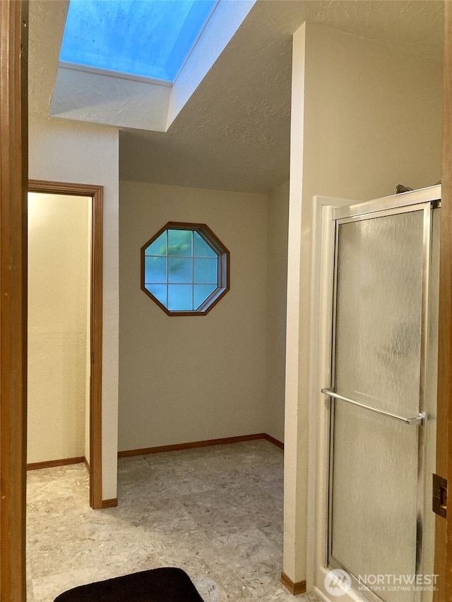 8322 Shoemaker Rd, Tulalip, WA 98271 - bathroom with a stall shower and baseboards