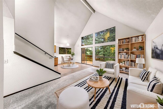 33 N Summit Dr, Bellingham, WA 98229 - living area with high vaulted ceiling, beam ceiling, stairs, and wood finished floors