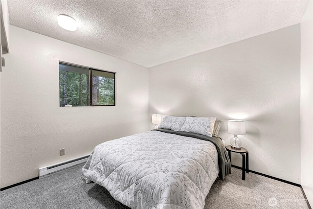 33 N Summit Dr, Bellingham, WA 98229 - bedroom featuring a baseboard radiator, carpet flooring, baseboards, a textured ceiling, and a textured wall