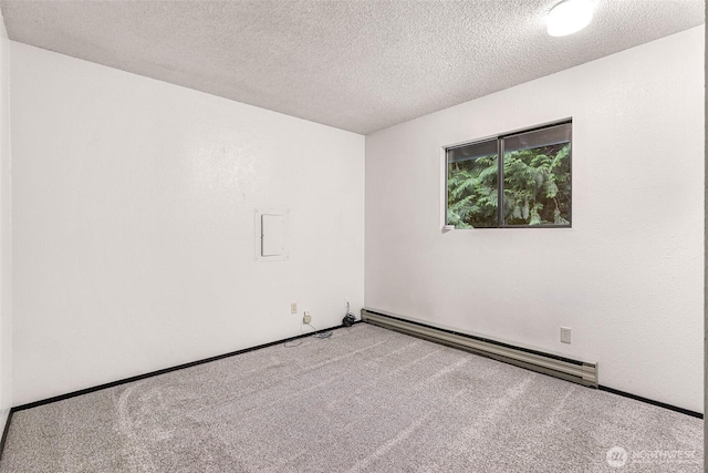 33 N Summit Dr, Bellingham, WA 98229 - spare room with a baseboard heating unit, carpet, and a textured ceiling