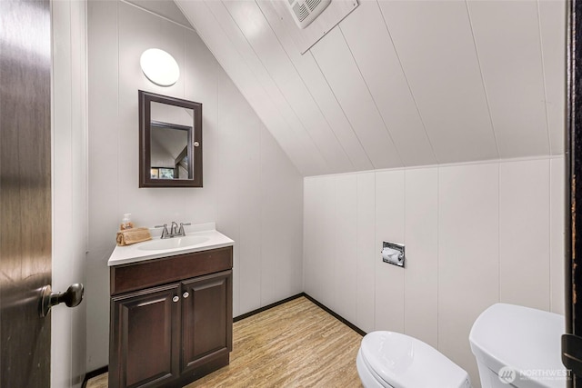 33 N Summit Dr, Bellingham, WA 98229 - bathroom with vaulted ceiling, toilet, wood finished floors, and vanity