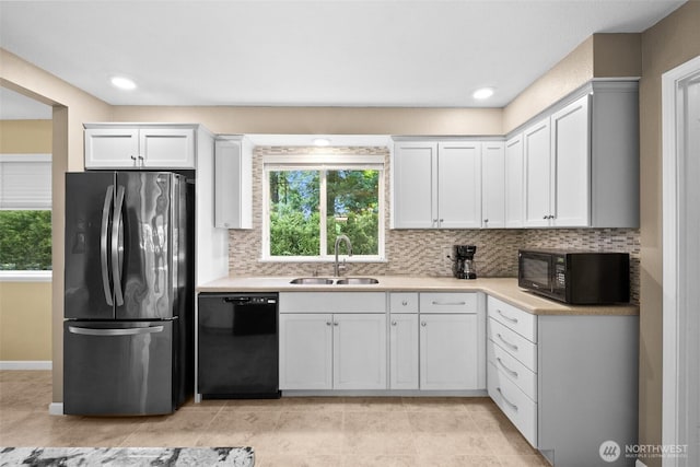 25721 173rd Ave SE, Covington, WA 98042 - kitchen with black appliances, a sink, plenty of natural light, tasteful backsplash, and recessed lighting