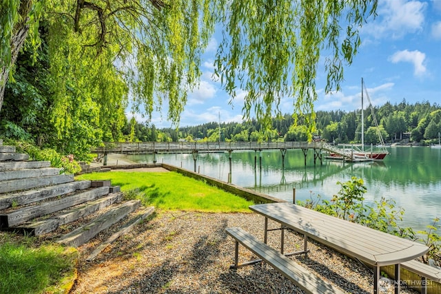 6490 NE Monte Vista Dr, Bainbridge Island, WA 98110 - view of yard featuring a water view, a dock, and a wooded view