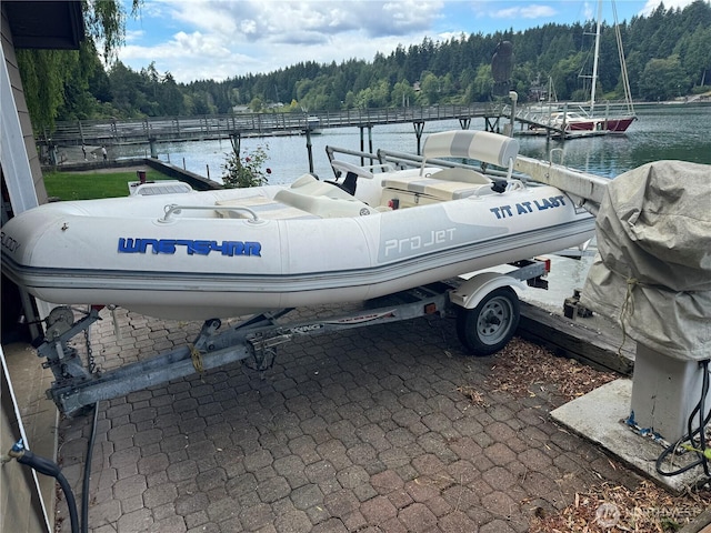 6490 NE Monte Vista Dr, Bainbridge Island, WA 98110 - dock area featuring a forest view and a water view